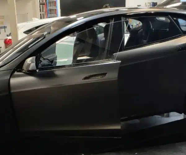 Tesla with matte automotive vinyl wrap completed by The Tint Pros in Orange County