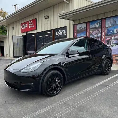 Black Tesla Model Y with professional window tinting by The Tint Pros in Orange County