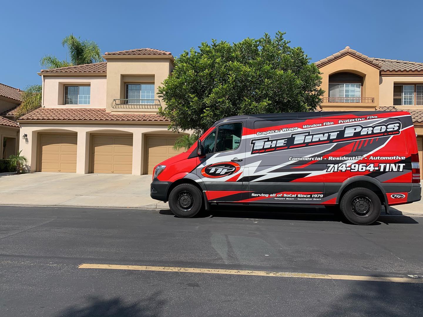 The Tint Pros branded business van promoting window tinting services in Huntington Beach and Costa Mesa, Orange County